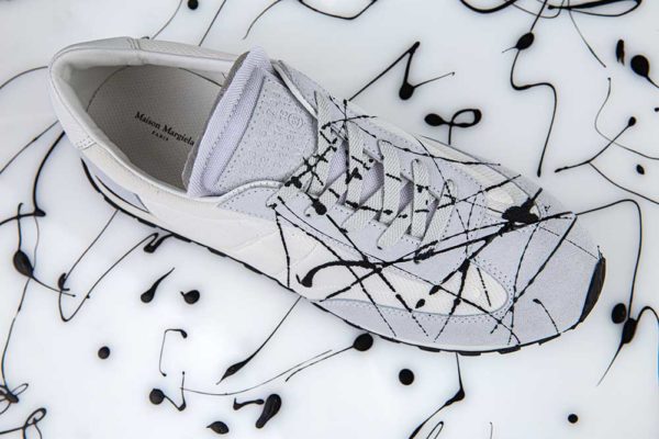 white_trainers_black_paint_splashes