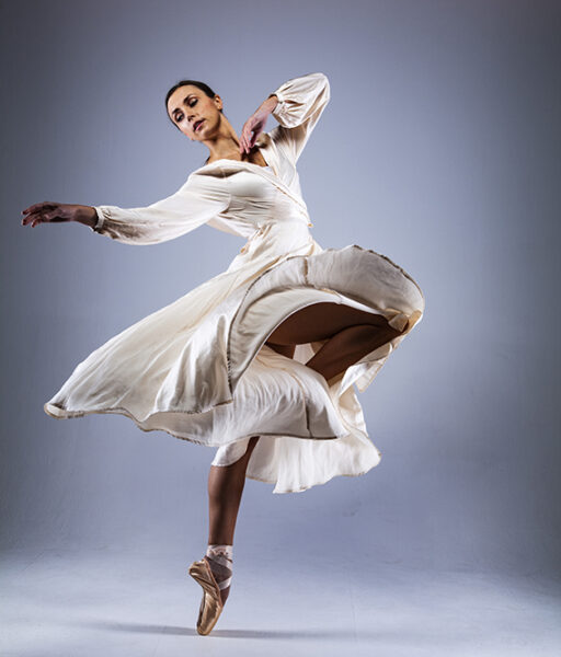 KATE BYRNE DANCING IN FLOWING DRESS